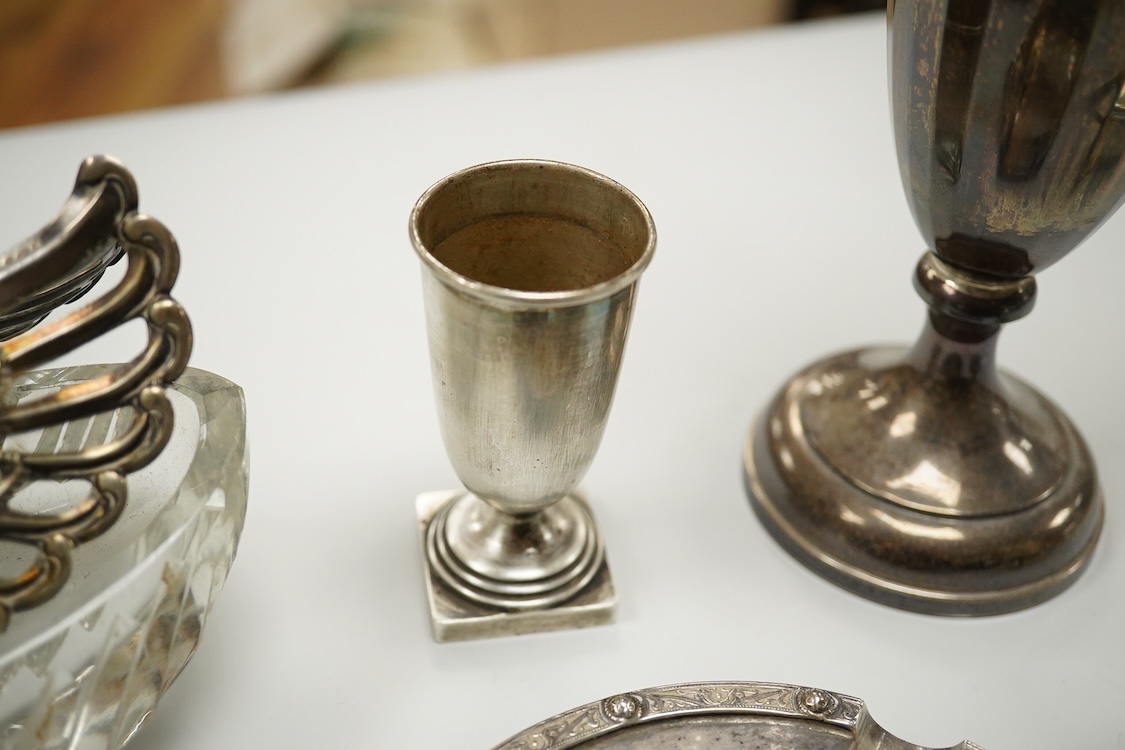 An Elizabeth II silver mounted vase with wavy border, Adie Brothers, Birmingham, 1955, weighted, 20.4cm, a silver mounted glass swan bonbon dish, a George V silver three piece condiment set, a silver mounted glass toilet